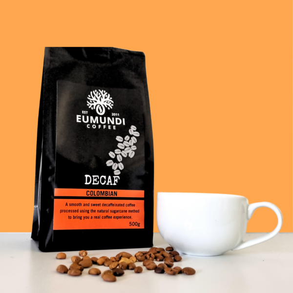Eumundi Coffee Decaf Coffee bag with coffee beans and coffee cup